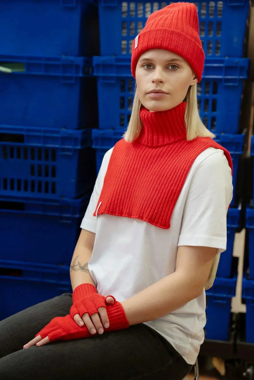 red hat, scarf, gloves worn by blonde woman