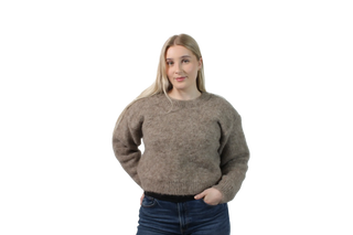 Woman wearing a brown sweater on a white background
